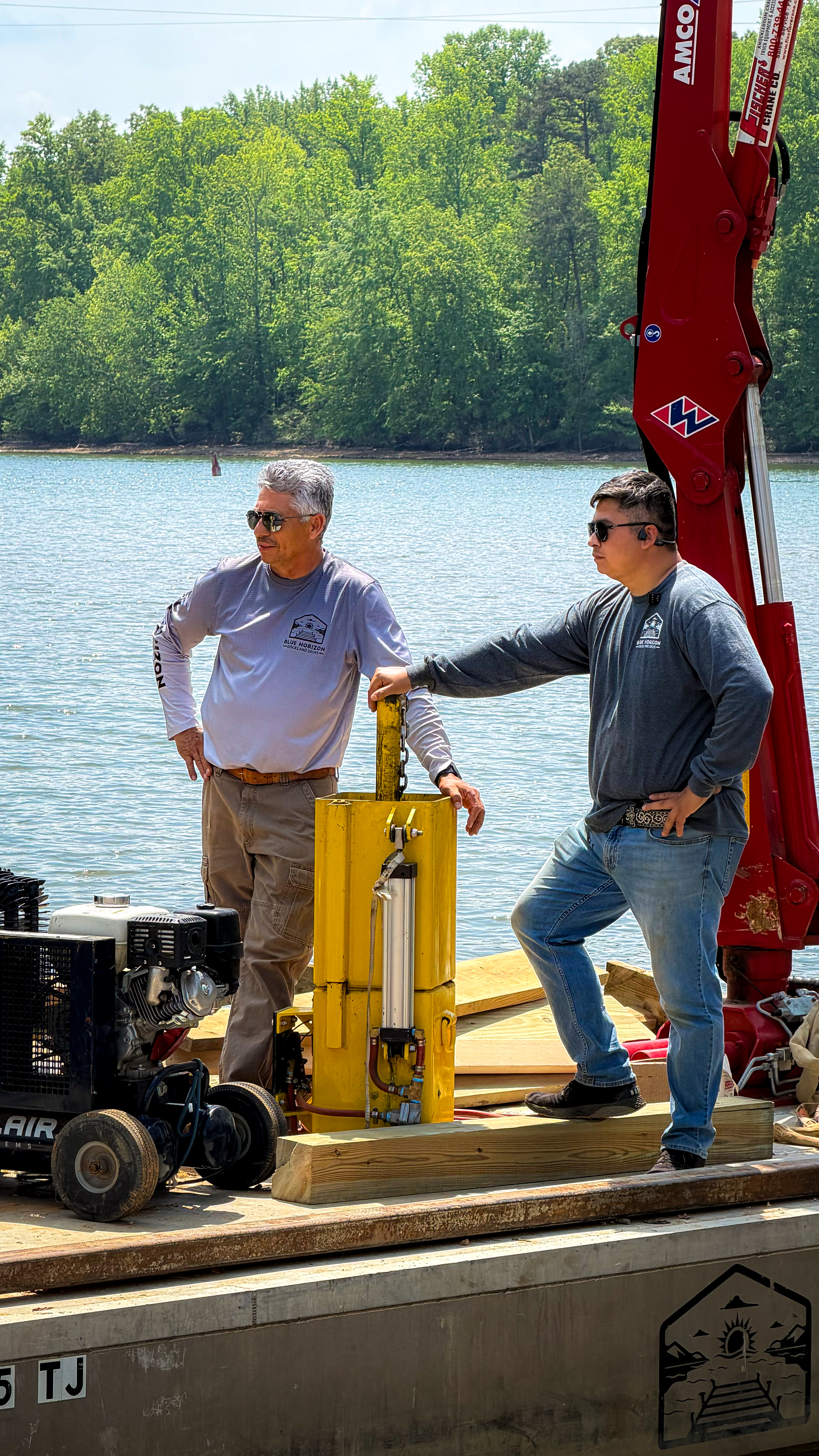 Blue Horizon crew assembling a dock with a portable hydraulic press