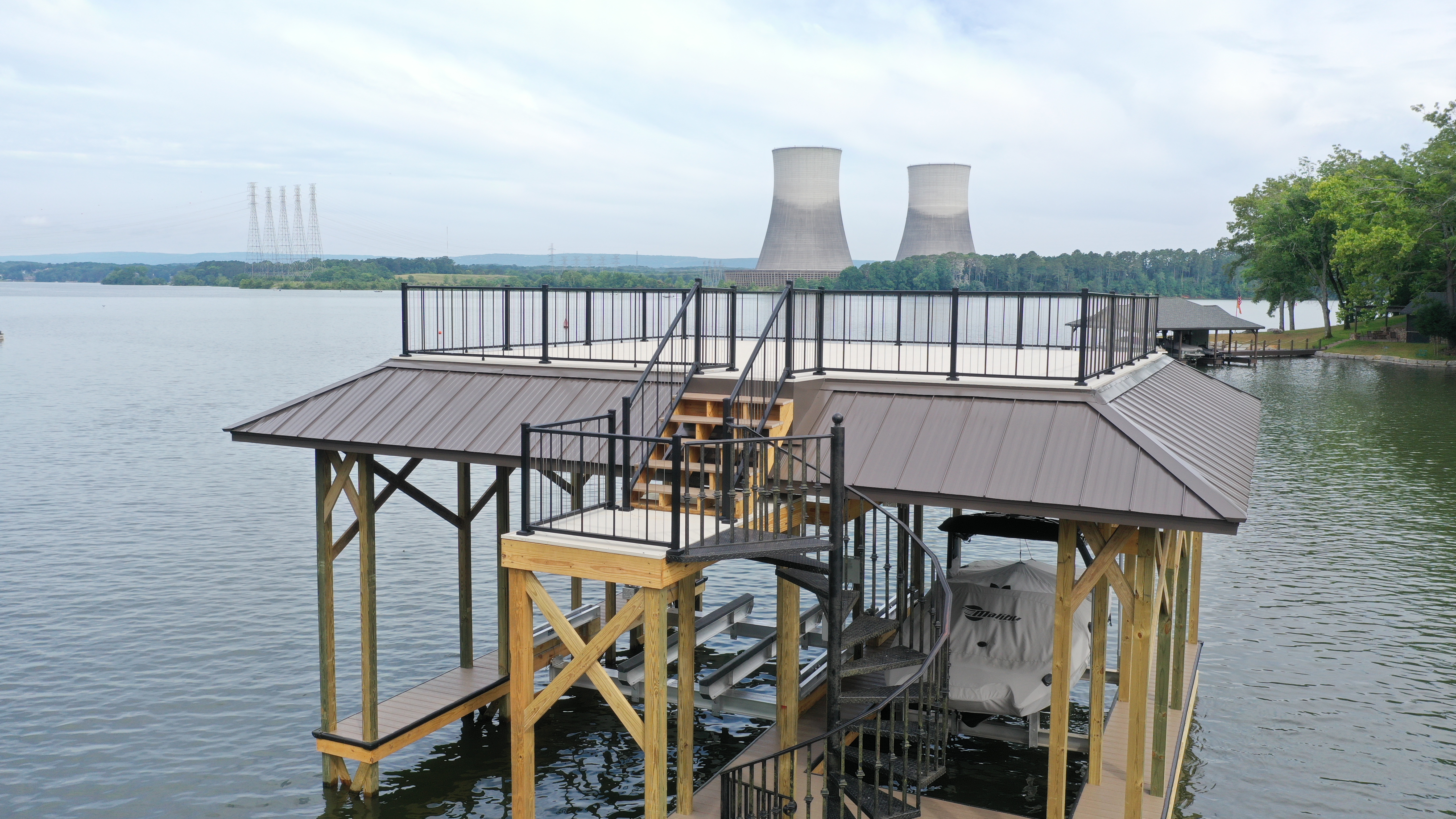 Finished fixed dock at Watts Bar Lake with industrial backdrop