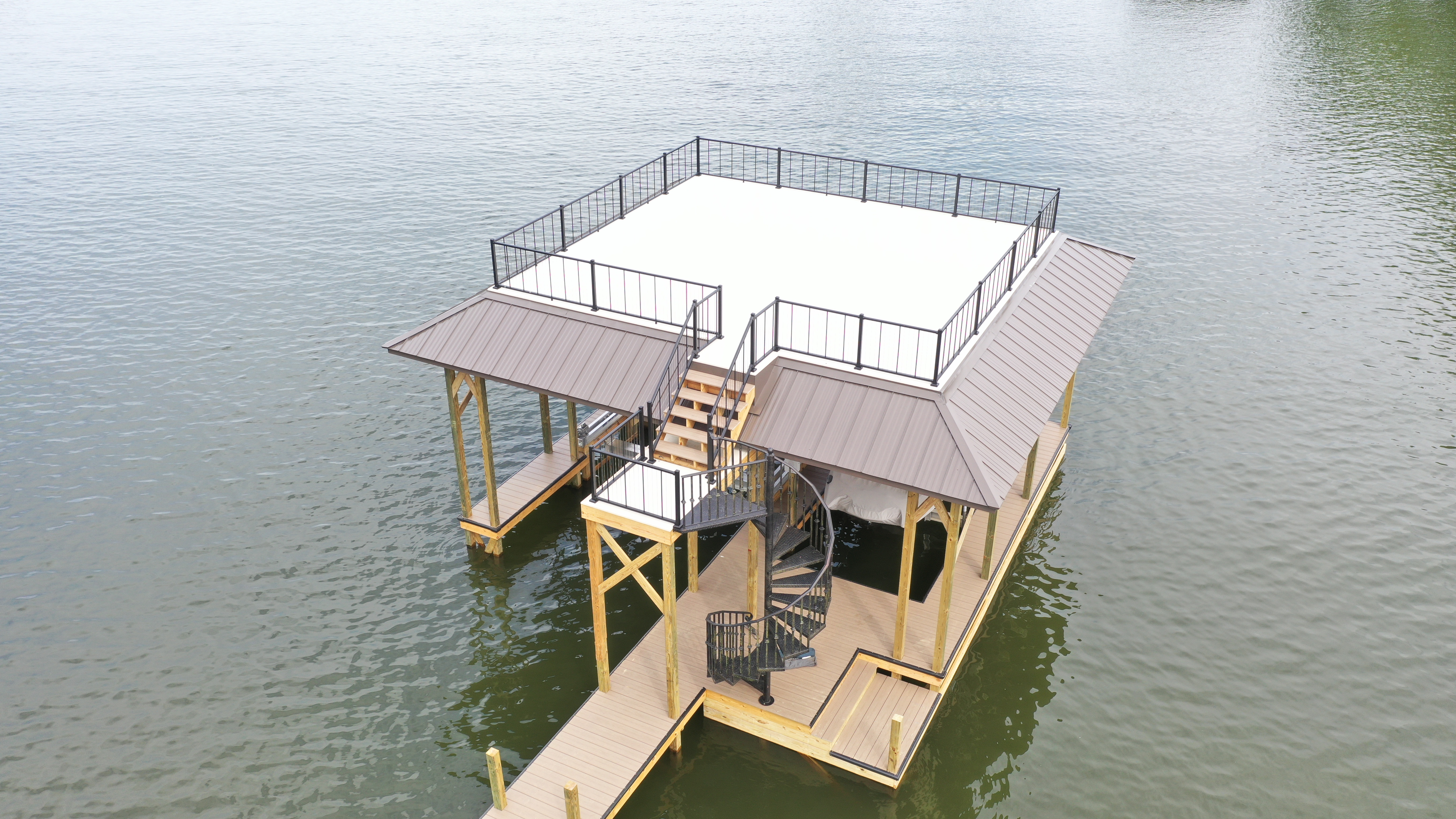 Single-section floating dock with covered slip on a calm Tennessee lake