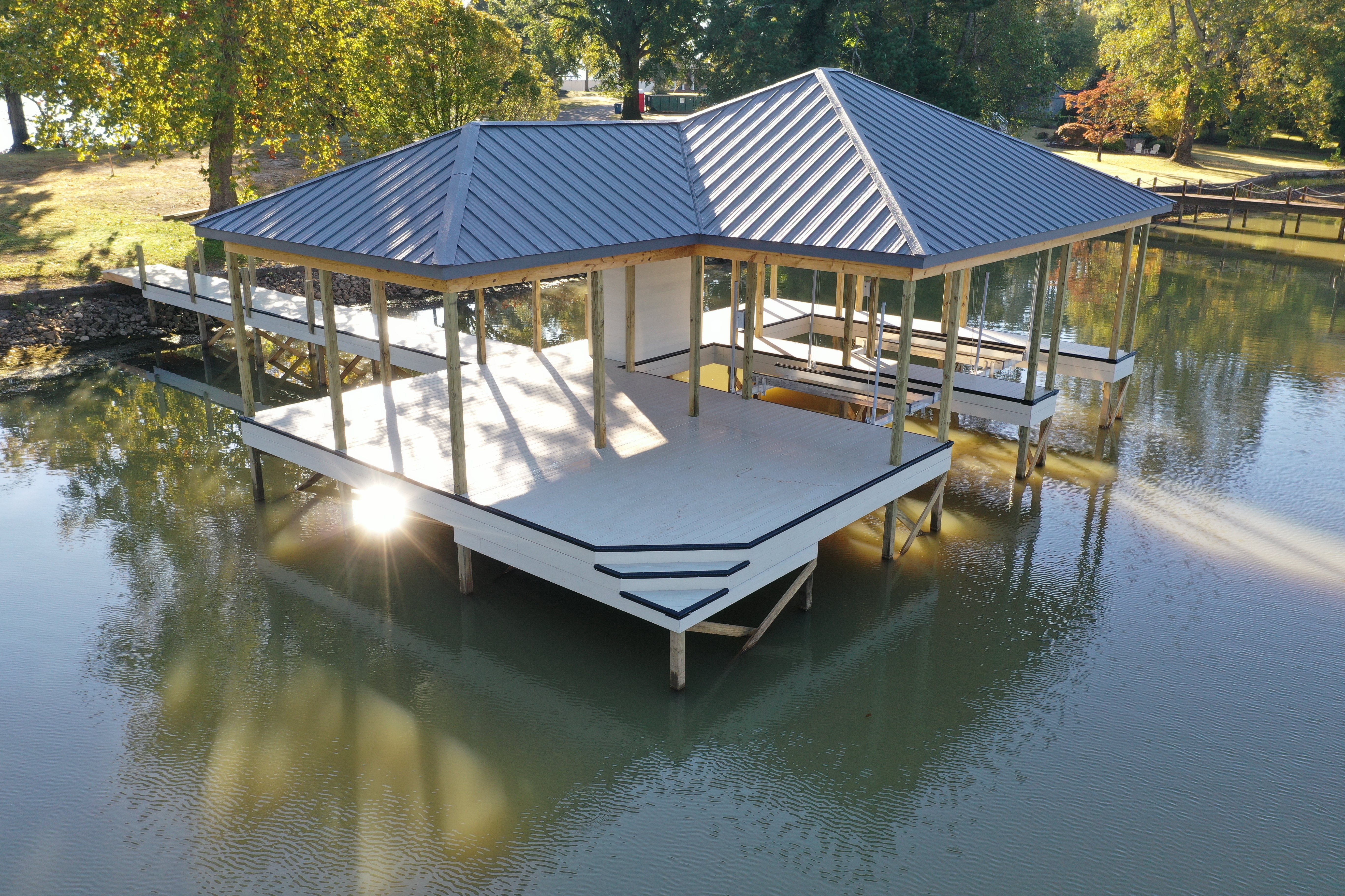 Blue metal roof double slip boathouse on Watts Bar